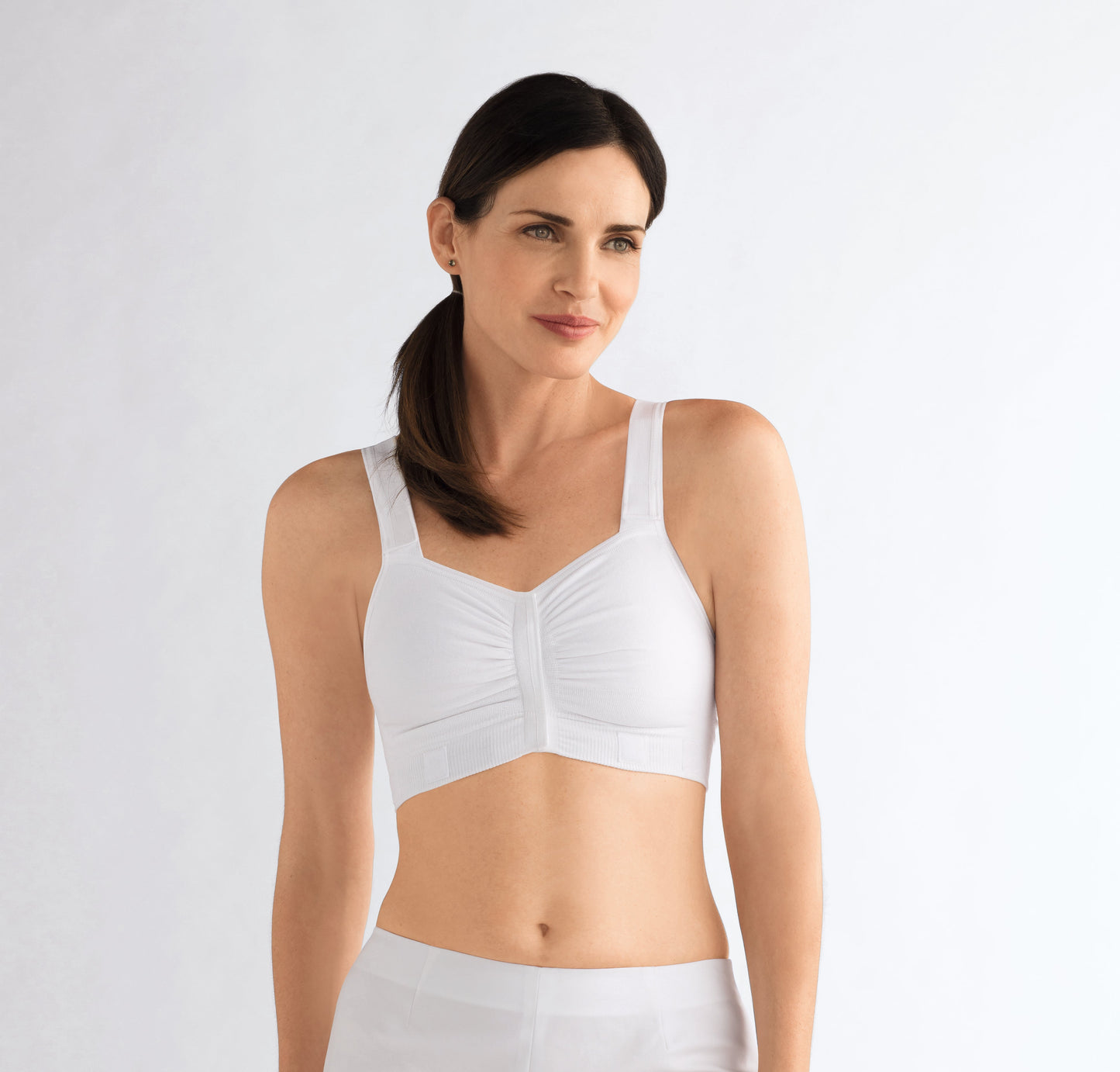 Compression Bra post mastectomy surgery with reconstruction  Specially designed for wear immediately after any type of breast surgery or while undergoing radiation treatments, including partial breast irradiation (seed radiation and brachytherapy) Seamless soft cotton garment features hook-and-loop fasteners on front closure and straps that allow for easy access to treatment areas without full undressing. Fabric may be cut on each side to accommodate a catheter for brachytherapy or seed radiation treatments