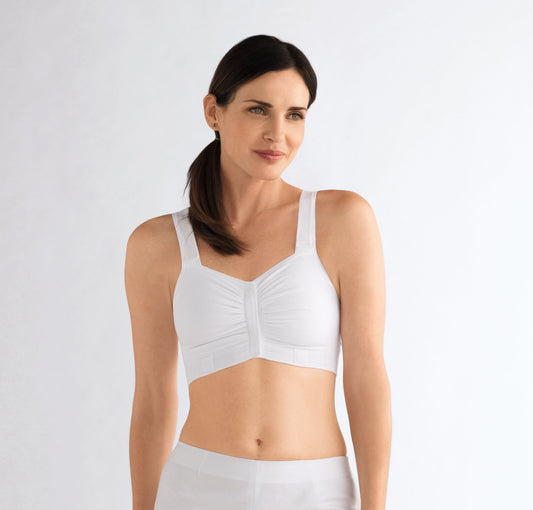 Compression Bra post mastectomy surgery with reconstruction  Specially designed for wear immediately after any type of breast surgery or while undergoing radiation treatments, including partial breast irradiation (seed radiation and brachytherapy) Seamless soft cotton garment features hook-and-loop fasteners on front closure and straps that allow for easy access to treatment areas without full undressing. Fabric may be cut on each side to accommodate a catheter for brachytherapy or seed radiation treatments